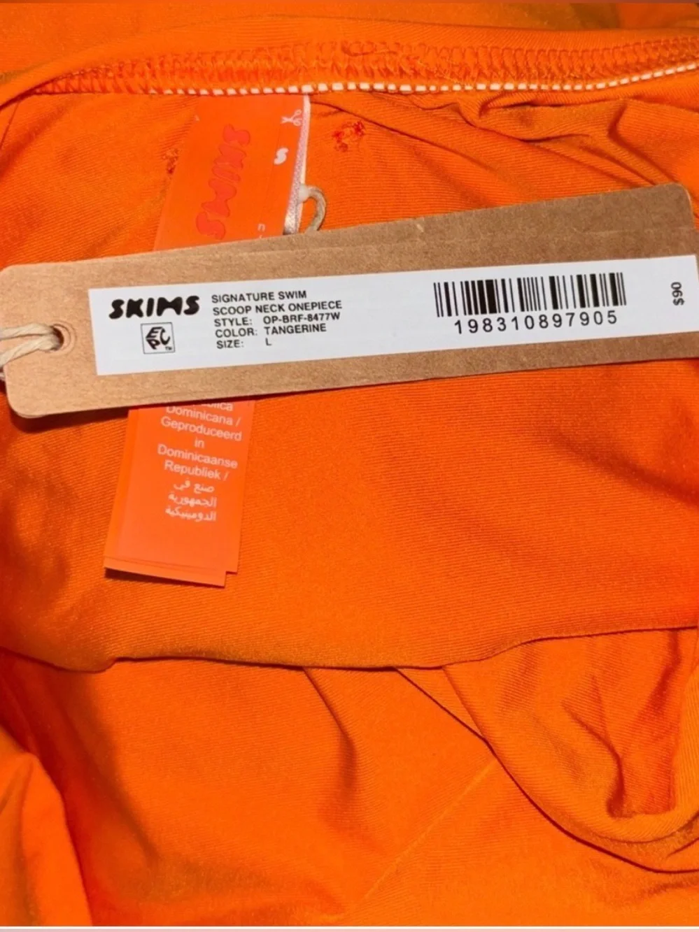 Skims signature swim one piece in Tangerine